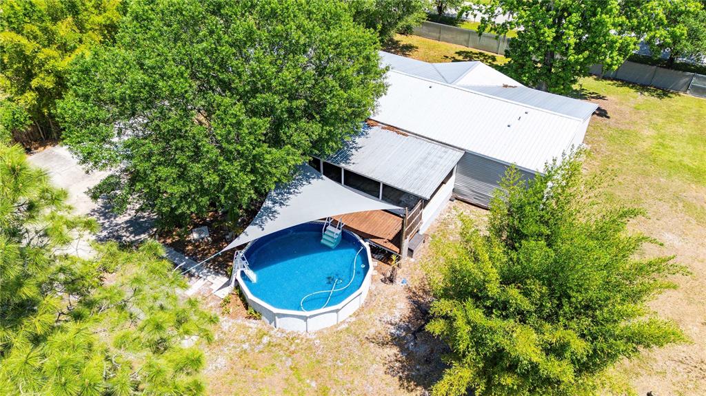 3319 Fox Ridge Boulevard Wesley Chapel, FL 33543 - Photo 41 of 50 an aerial view of a house with a swimming pool