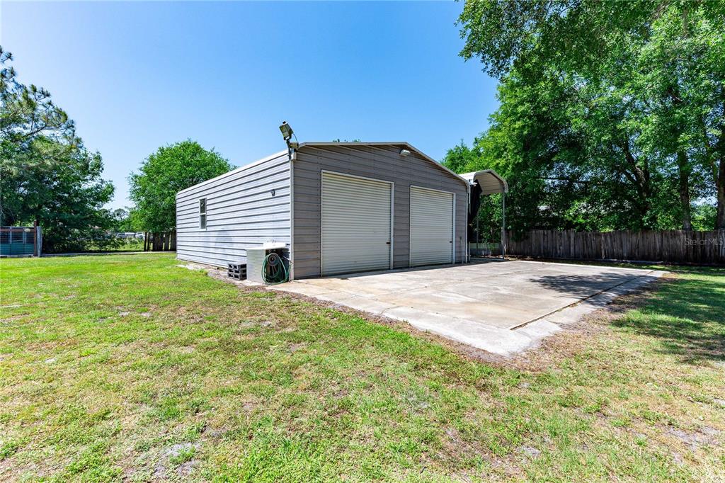 3319 Fox Ridge Boulevard Wesley Chapel, FL 33543 - Photo 42 of 50 a house with yard in front of it