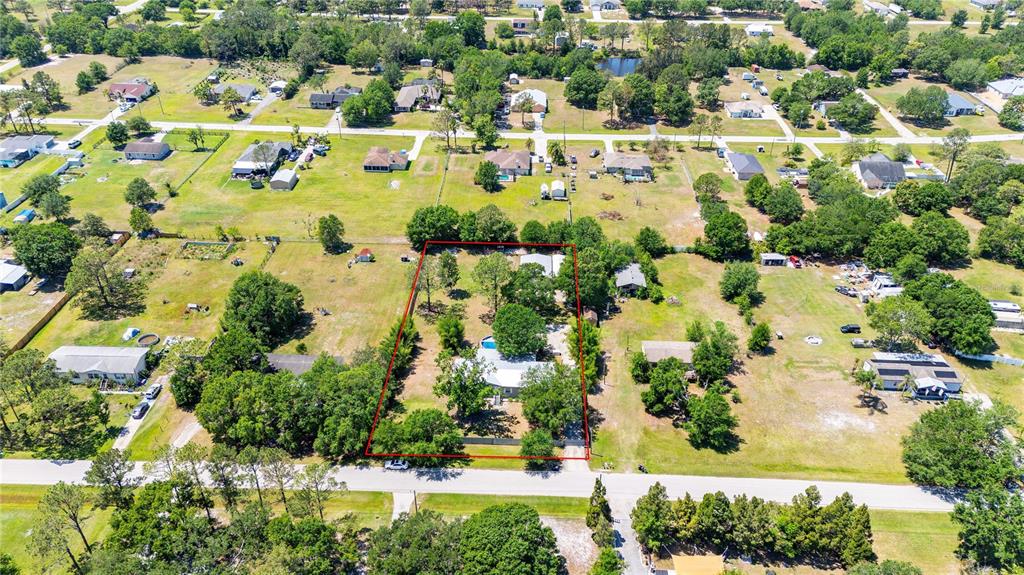 3319 Fox Ridge Boulevard Wesley Chapel, FL 33543 - Photo 48 of 50 an aerial view of residential houses with outdoor space