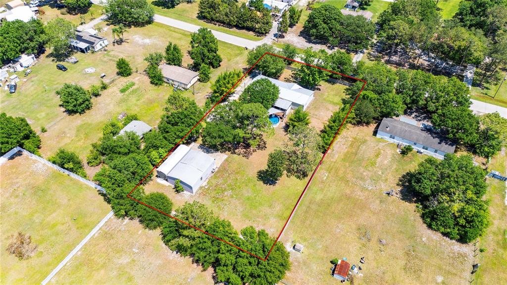 3319 Fox Ridge Boulevard Wesley Chapel, FL 33543 - Photo 50 of 50 an aerial view of residential houses with swimming pool