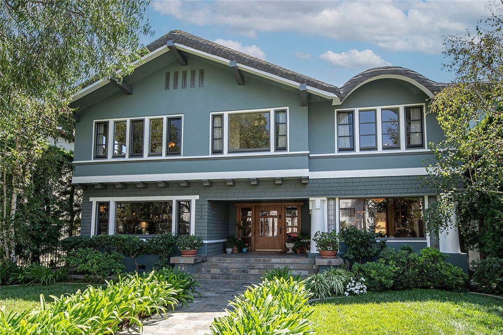 3216 2nd Street Long Beach, CA 90803 - Photo 17 of 62 a front view of a house with garden and porch