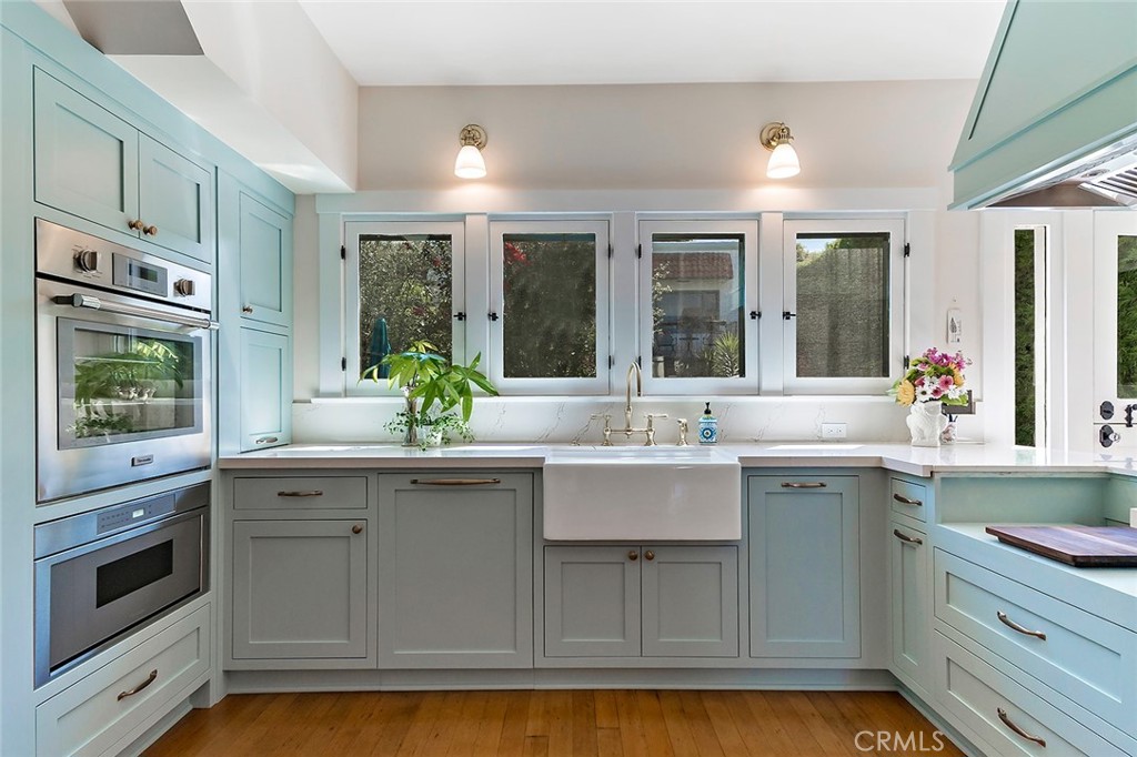 3216 2nd Street Long Beach, CA 90803 - Photo 22 of 62 a kitchen with stainless steel appliances granite countertop a sink and cabinets