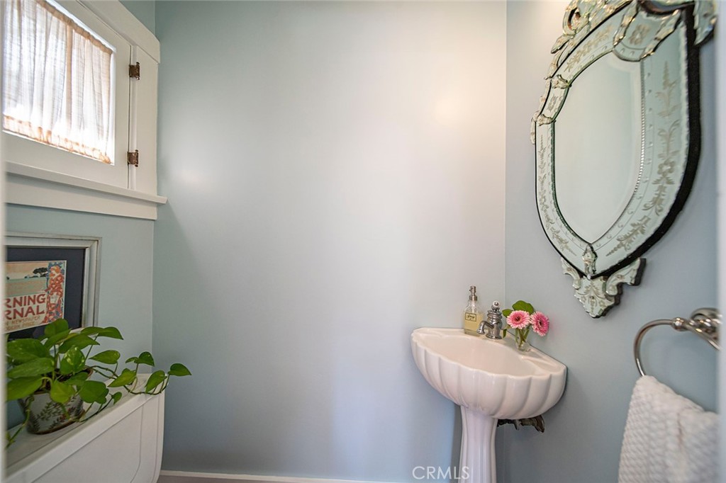 3216 2nd Street Long Beach, CA 90803 - Photo 25 of 62 a bathroom with a sink mirror and vanity