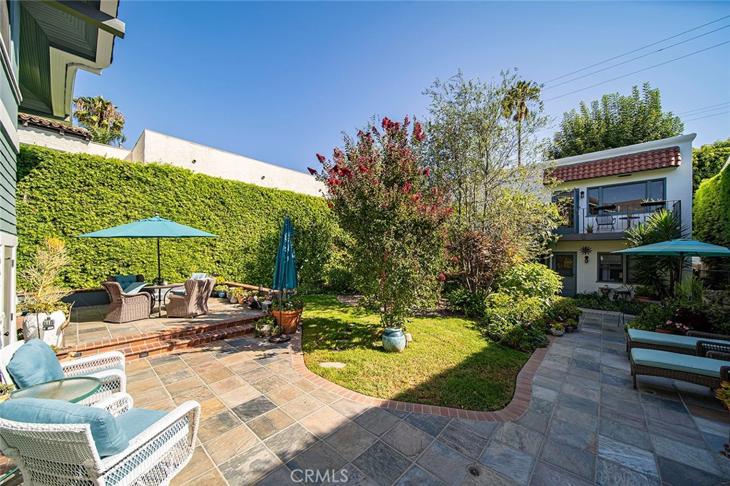 3216 2nd Street Long Beach, CA 90803 - Photo 3 of 62 a view of a backyard with plants and a patio