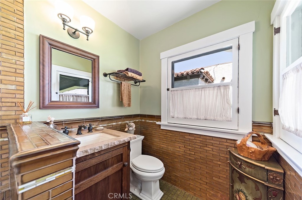 3216 2nd Street Long Beach, CA 90803 - Photo 33 of 62 a bathroom with a sink a toilet and a mirror