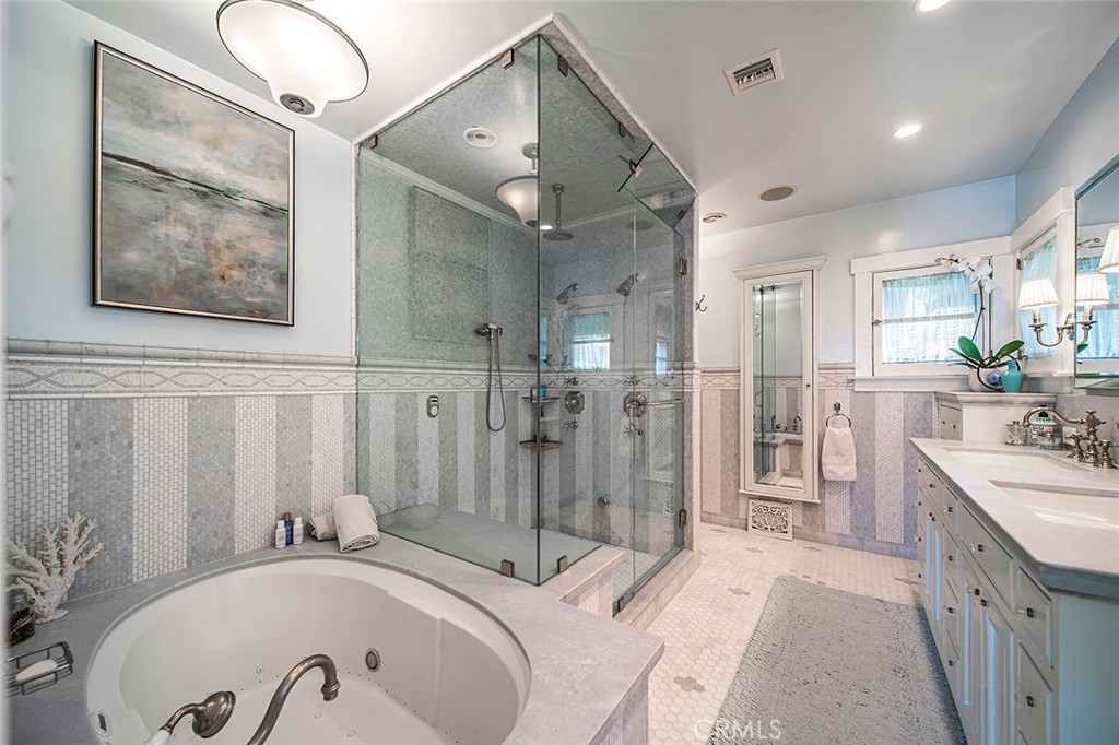 3216 2nd Street Long Beach, CA 90803 - Photo 38 of 62 a spacious bathroom with a tub sink and mirror
