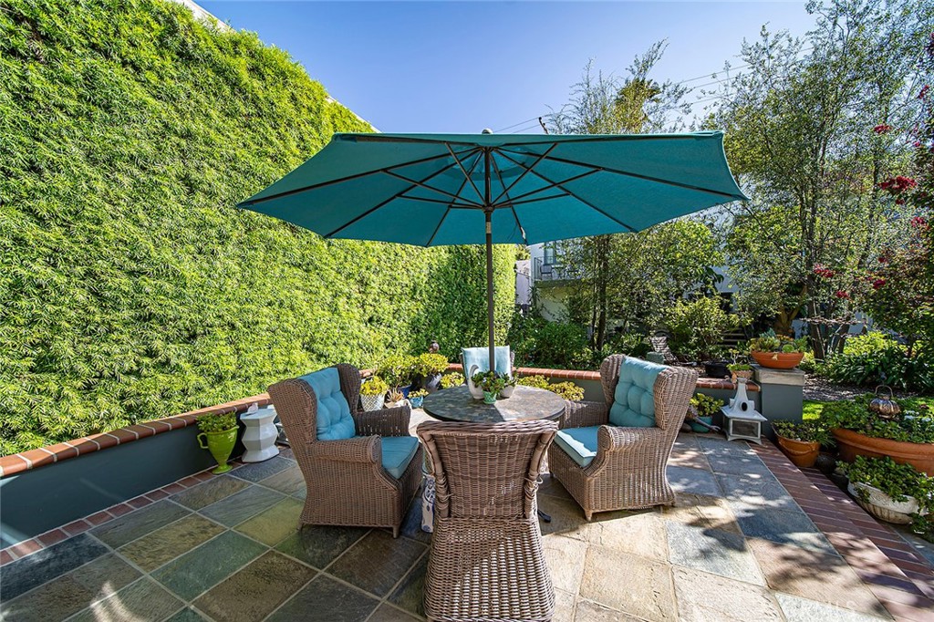 3216 2nd Street Long Beach, CA 90803 - Photo 39 of 62 an outdoor sitting area with furniture and umbrella