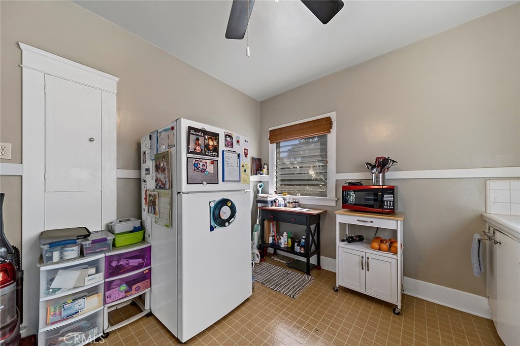 3216 2nd Street Long Beach, CA 90803 - Photo 54 of 62 a view of a kitchen with fridge and workspace