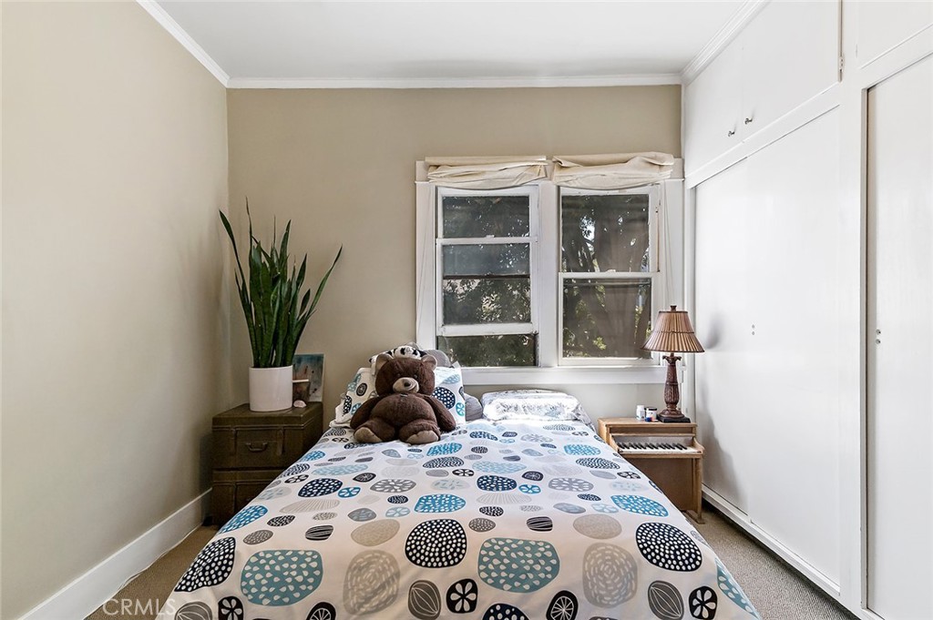 3216 2nd Street Long Beach, CA 90803 - Photo 55 of 62 a bedroom with a bed and wooden floor