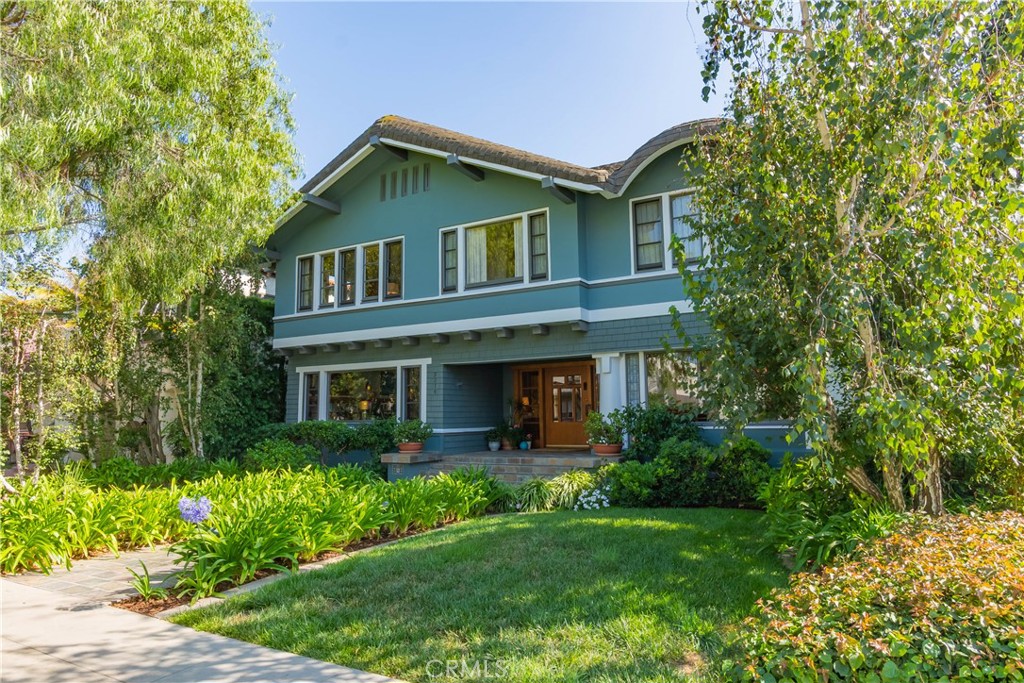 3216 2nd Street Long Beach, CA 90803 - Photo 61 of 62 a front view of a house with a garden and plants