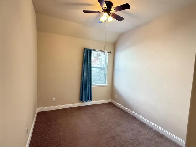 a living room with a flat screen tv and a door