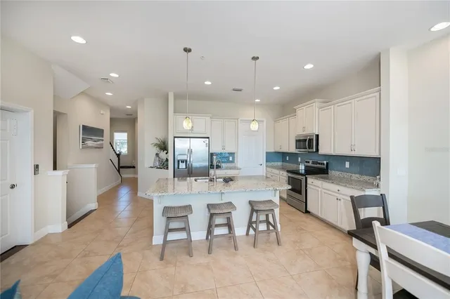 a bedroom with a bed dresser and a window