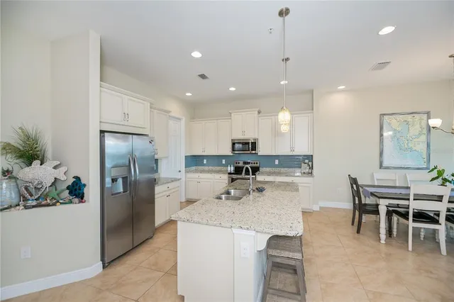 a bedroom with a bed and a table with wooden floor