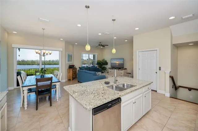 a bathroom with a granite countertop sink a toilet and a mirror