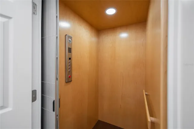 a bathroom with a granite countertop sink a toilet and a mirror