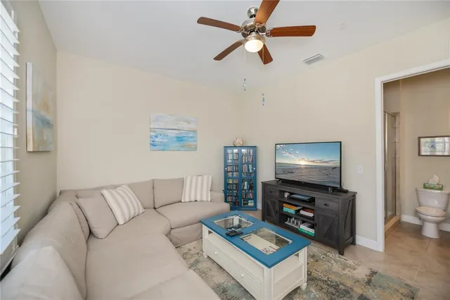 a view of a house with brick walls and flower plants