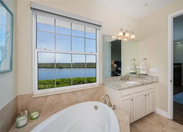 a living room with furniture pool table and window