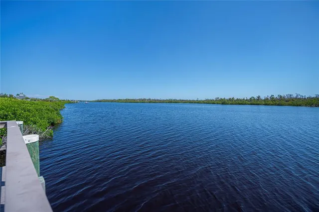 a living room with furniture and a mirror