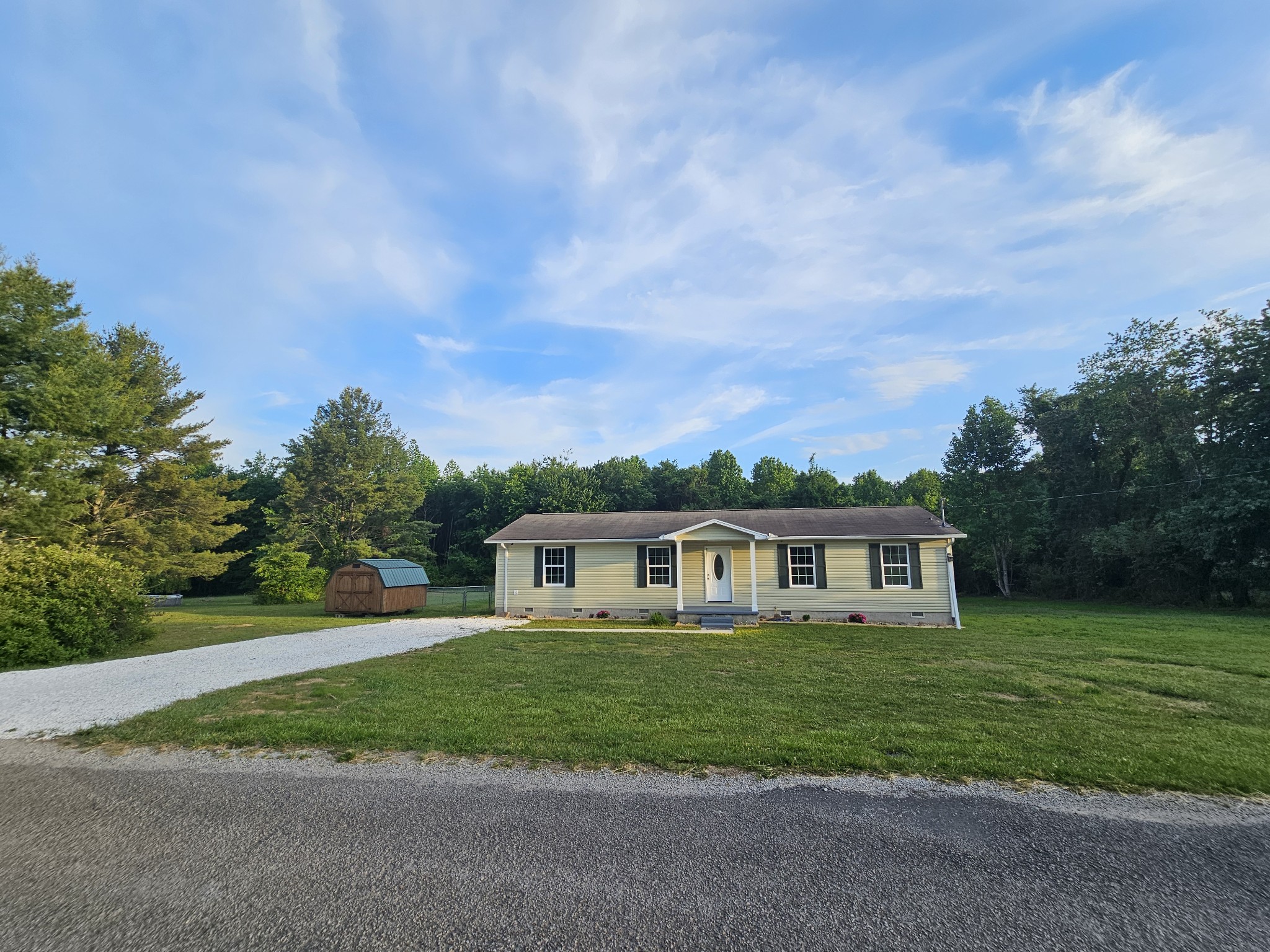 362 Forest Point Road Monteagle, TN 37356 - Photo 10 of 42 a view of house with yard and trees in the background