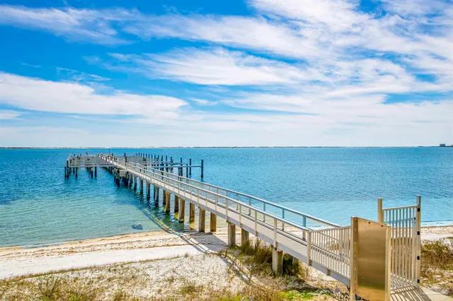 a lobby with furniture and a chandelier