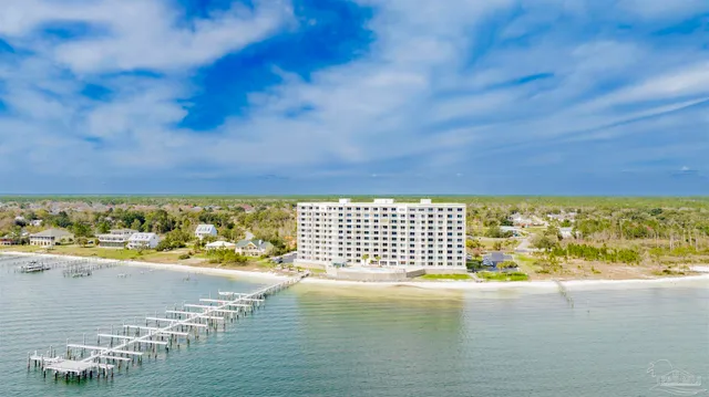 a living room with furniture and a lamp