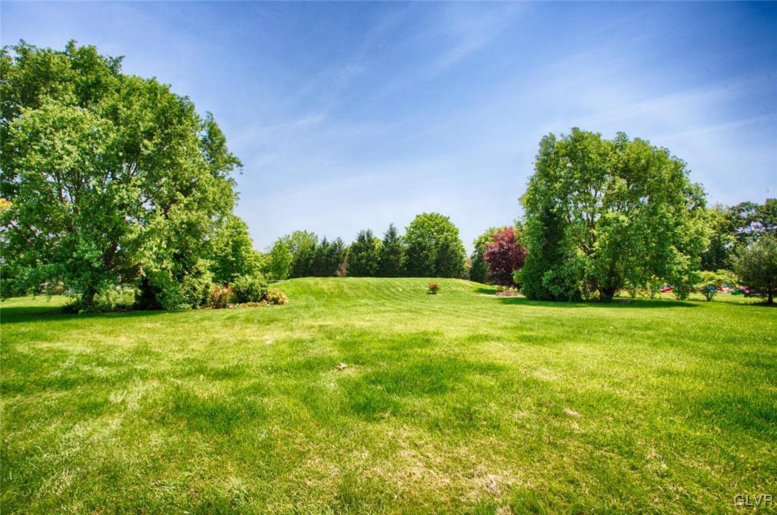 1068 Miller Road Wind Gap, PA 18091 - Photo 38 of 40 a backyard of a house with lots of green space and garden