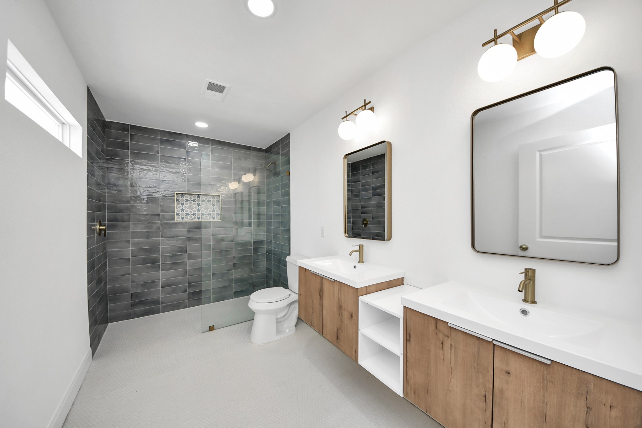 300 Narcissus Road Kemah, TX 77565 - Photo 2 of 47 a bathroom with a double vanity sink mirror double shower and a toilet