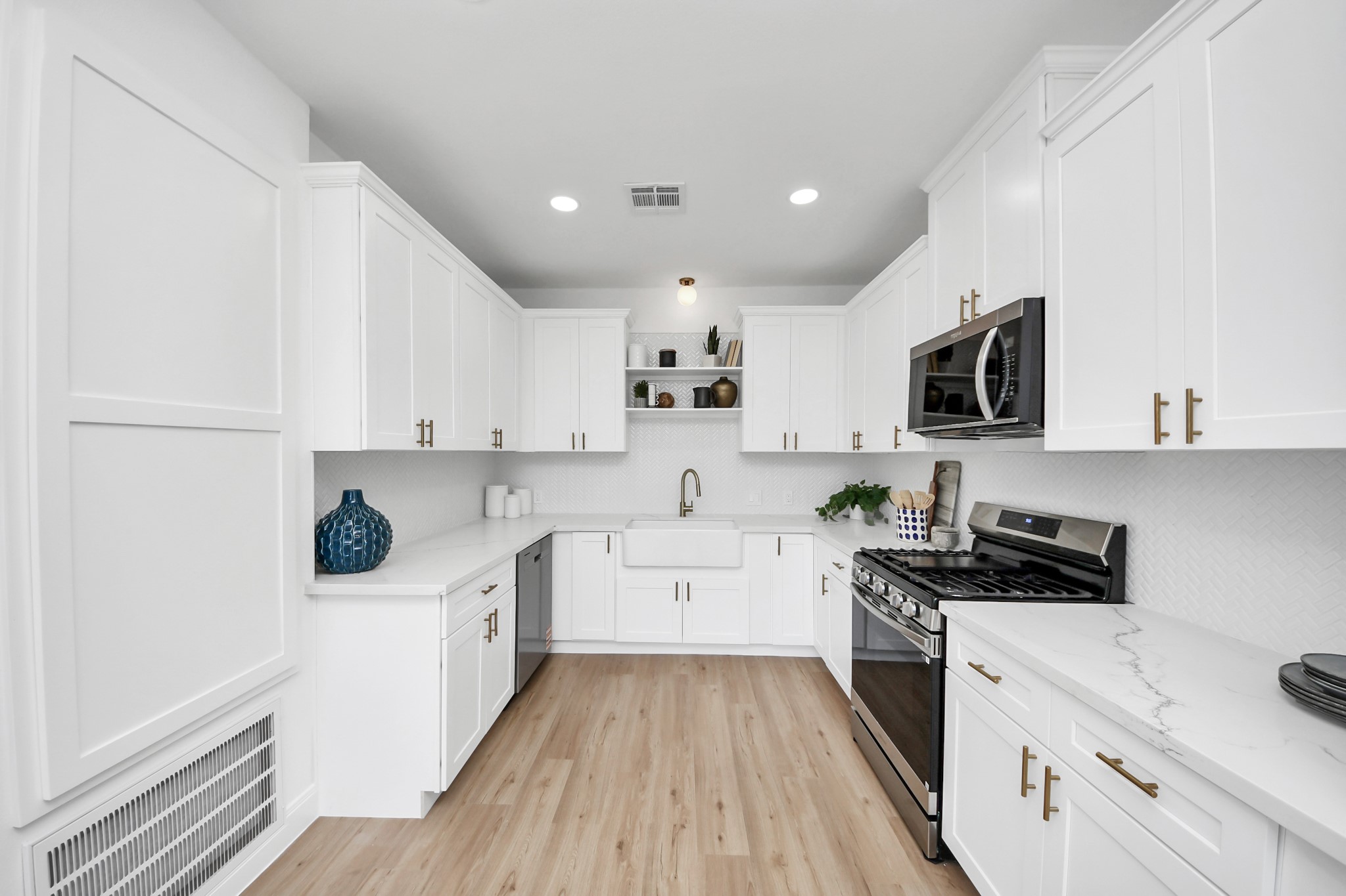 300 Narcissus Road Kemah, TX 77565 - Photo 21 of 47 a kitchen with a sink a stove and cabinets