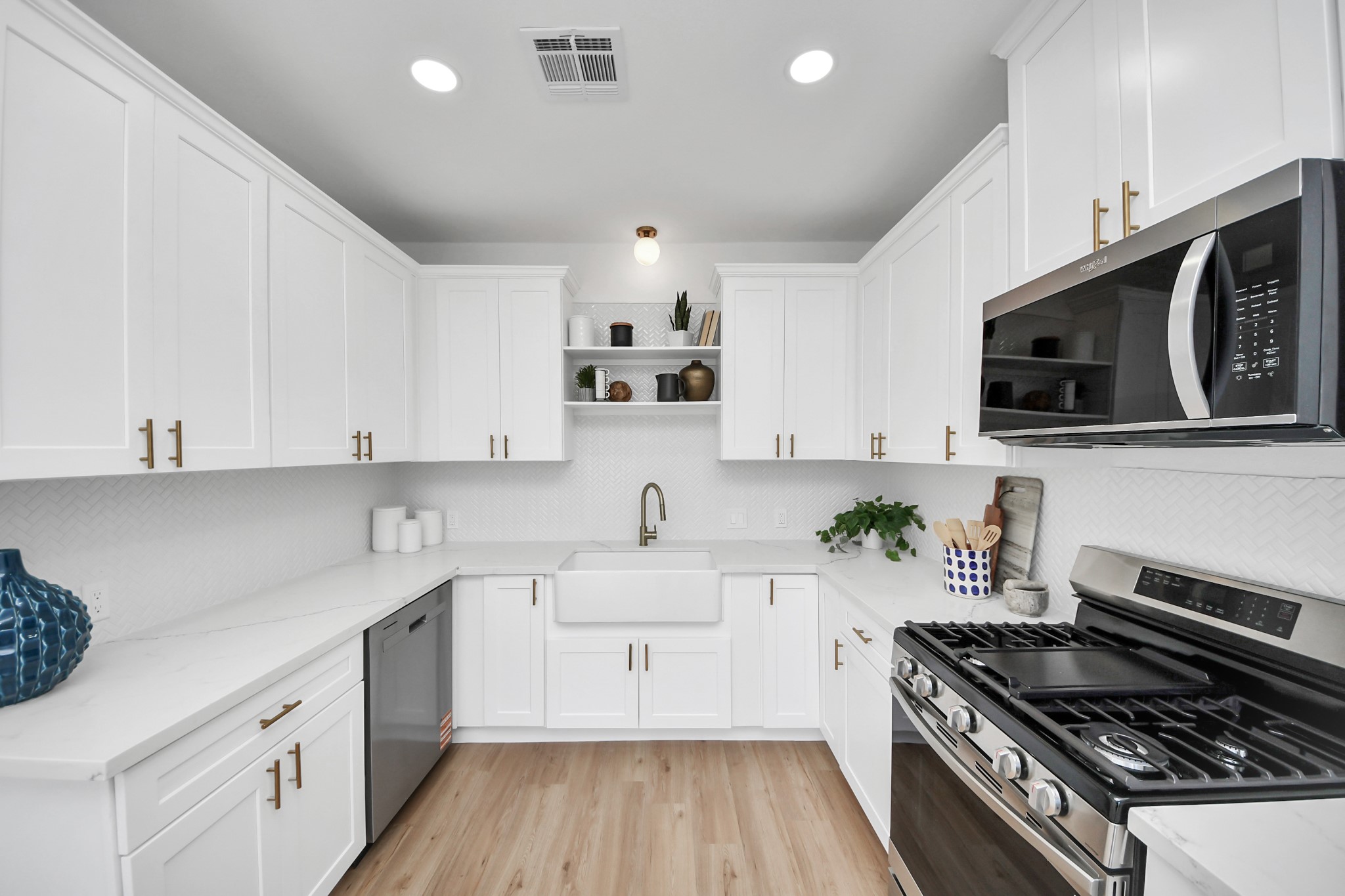 300 Narcissus Road Kemah, TX 77565 - Photo 23 of 47 a kitchen with a sink a stove and cabinets