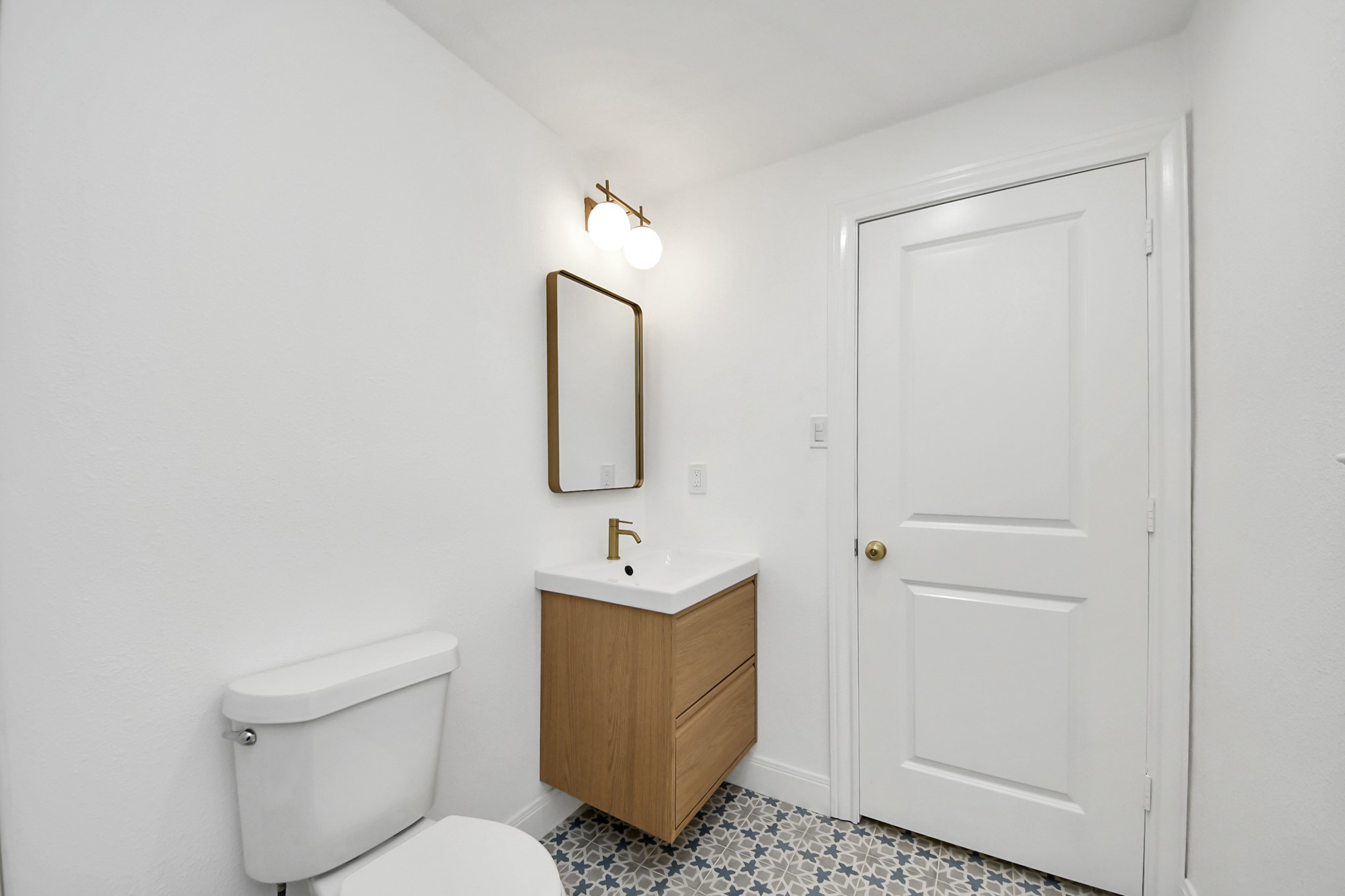 300 Narcissus Road Kemah, TX 77565 - Photo 34 of 47 a bathroom with a sink a toilet and mirror