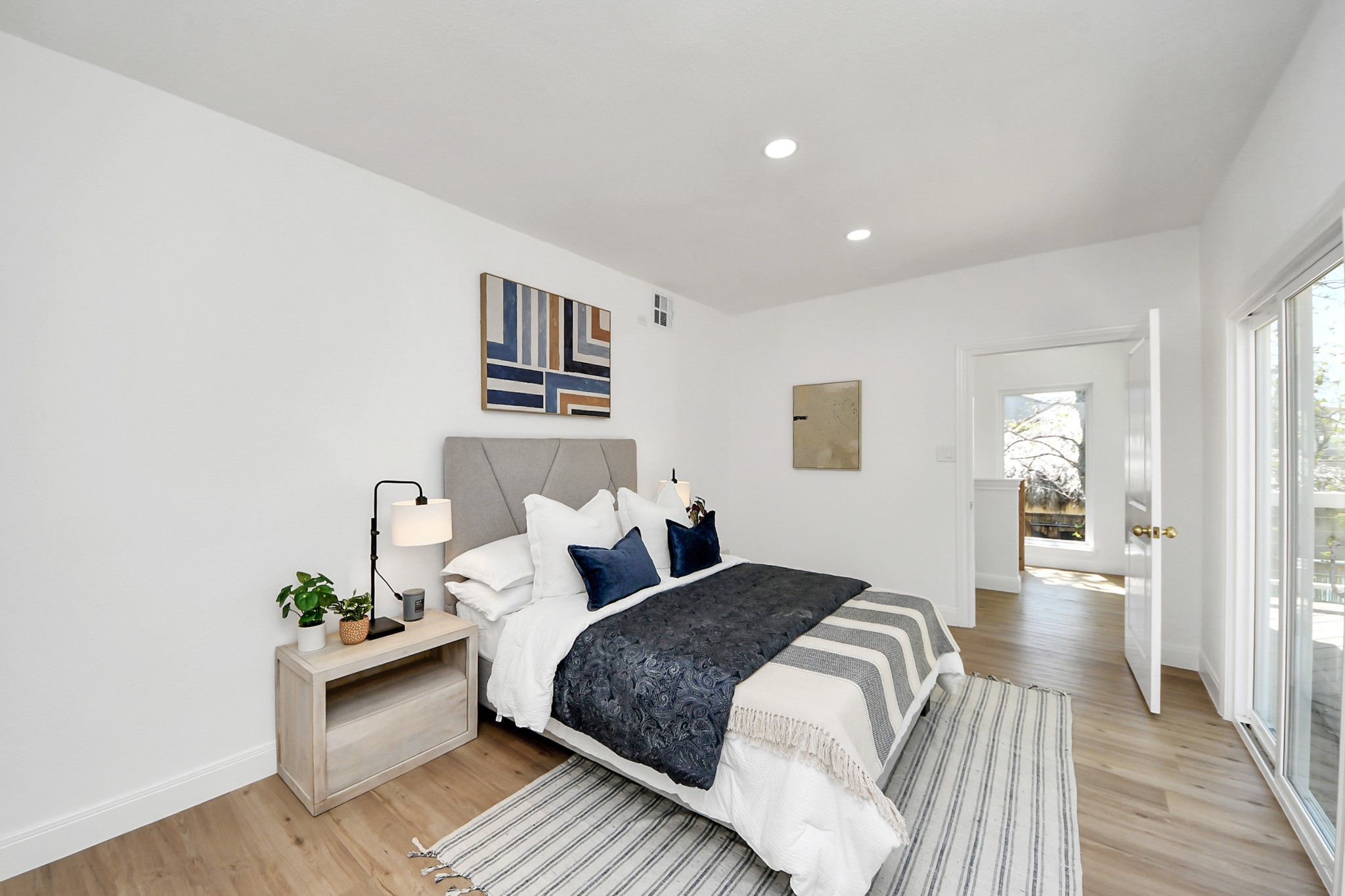 300 Narcissus Road Kemah, TX 77565 - Photo 36 of 47 a spacious bedroom with a bed and wooden floor