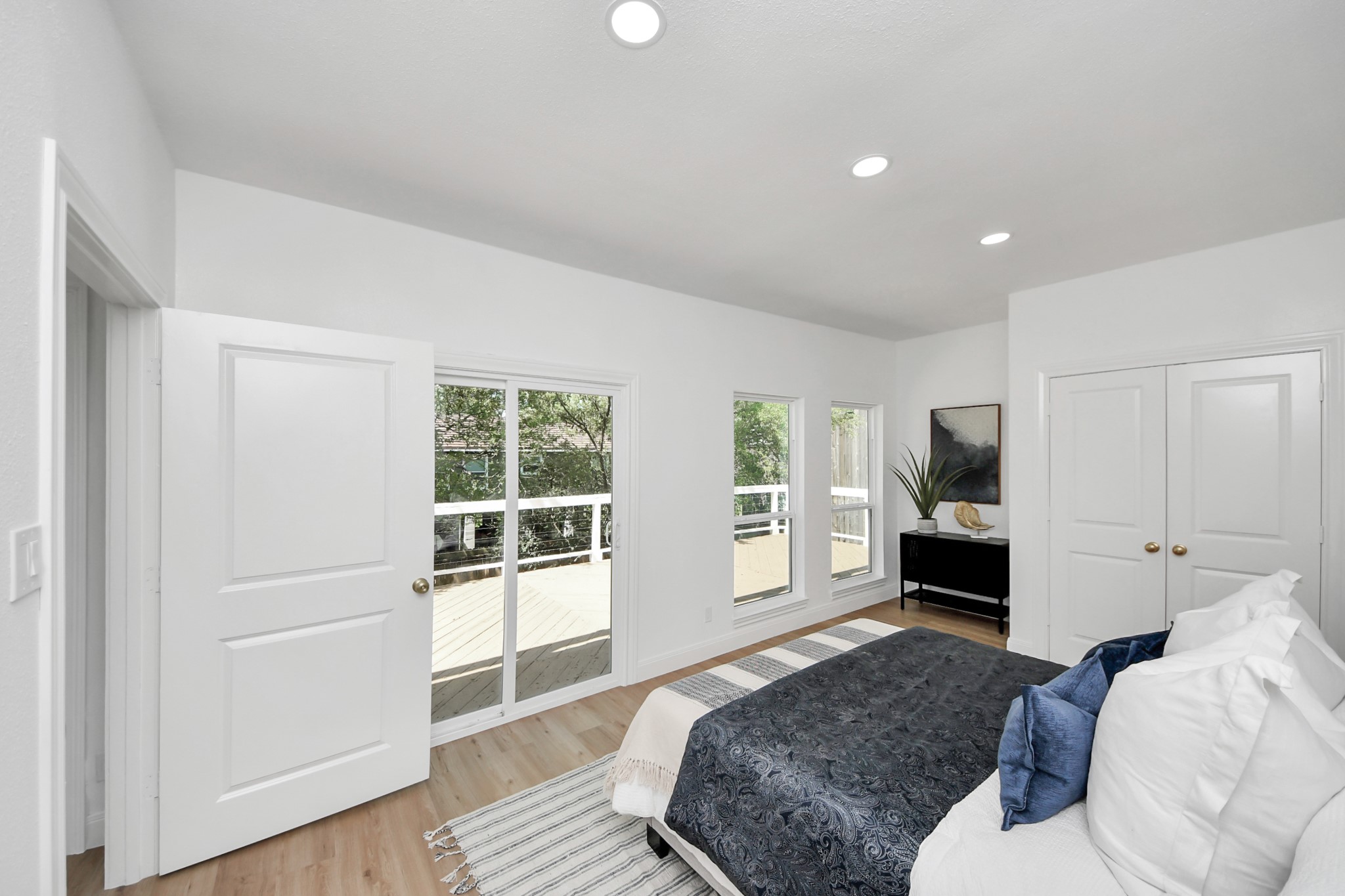 300 Narcissus Road Kemah, TX 77565 - Photo 37 of 47 a spacious bedroom with a bed and wooden floor