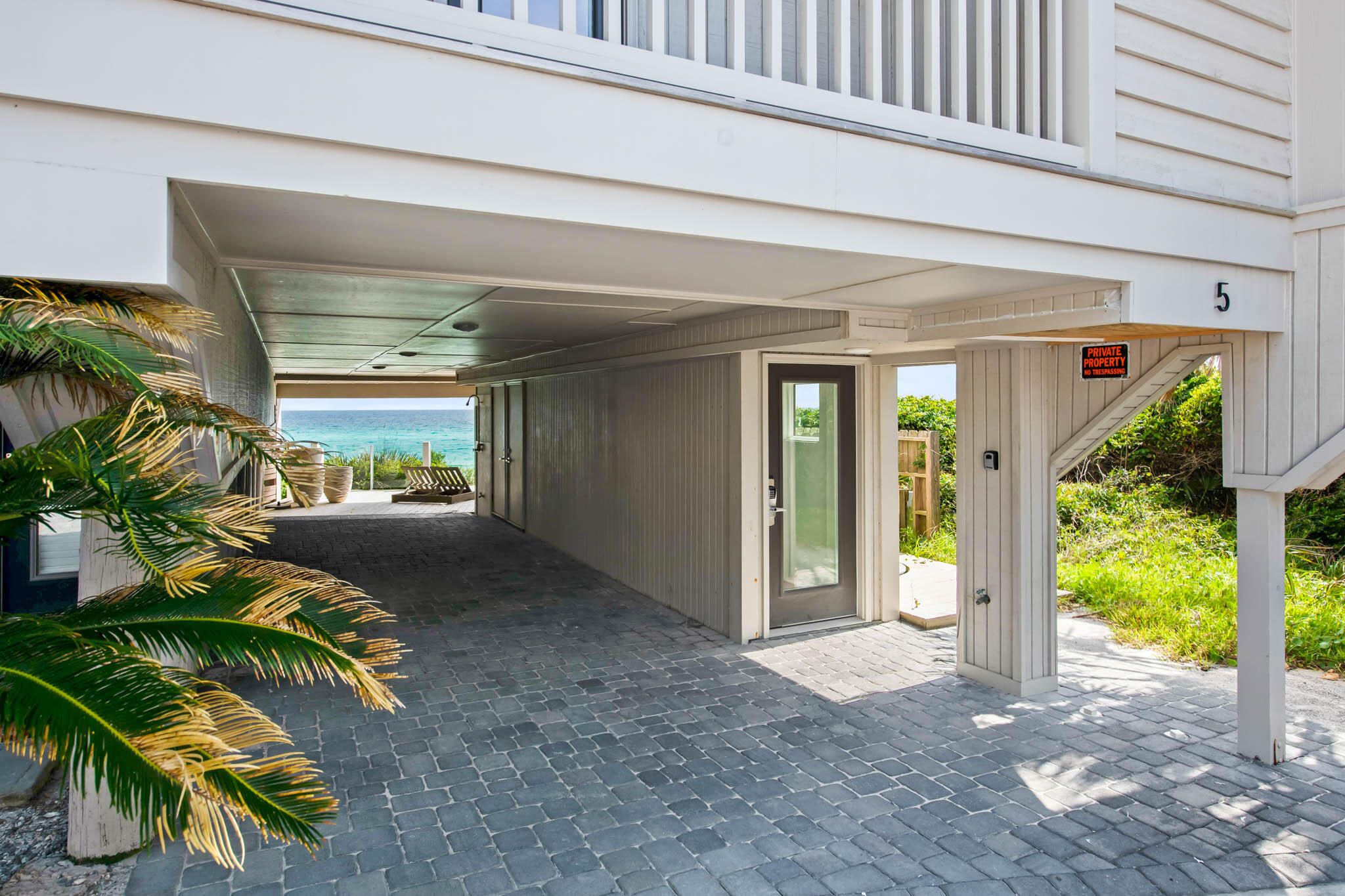 49 Hinton Drive, Unit 5 Santa Rosa Beach, FL 32459 - Photo 52 of 58 a view of a house with a yard and potted plants