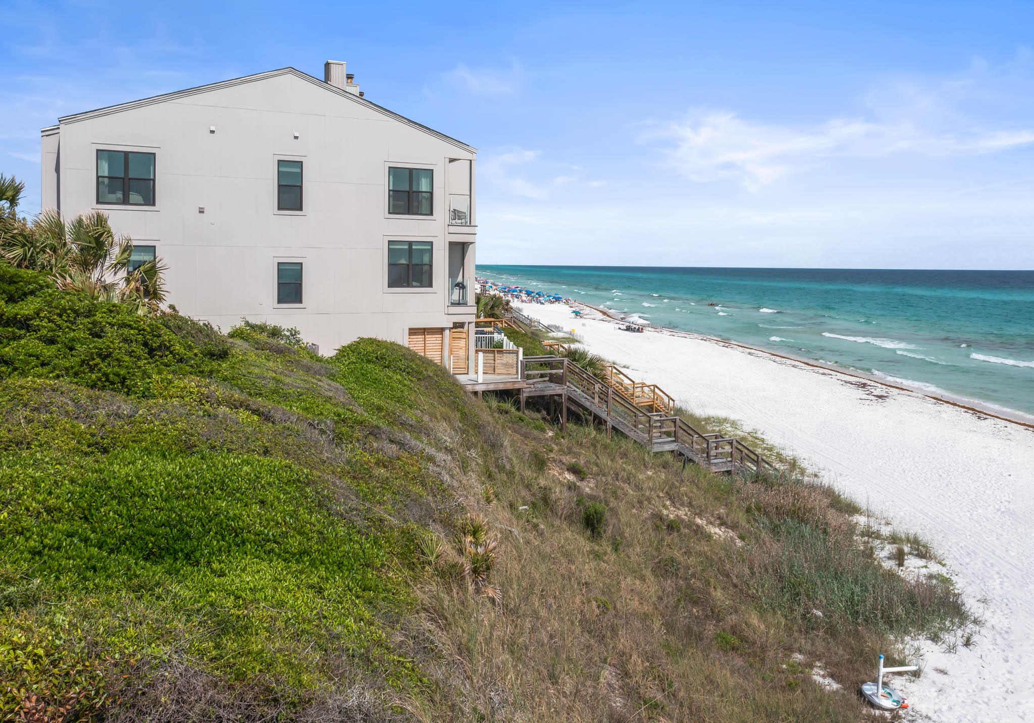 49 Hinton Drive, Unit 5 Santa Rosa Beach, FL 32459 - Photo 57 of 58 a view of a white house with a yard and a large tree