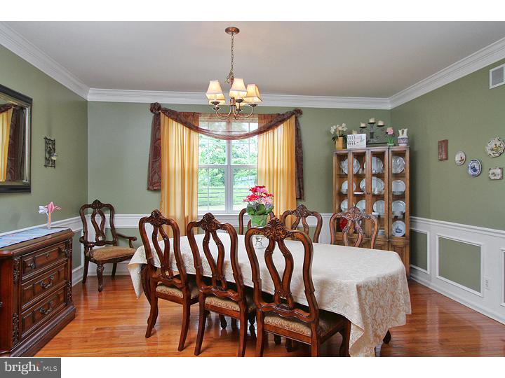 160 Prairie View Lane Mickleton, NJ 08056 - Photo 6 of 20 a view of a dining room with furniture wooden floor and chandelier