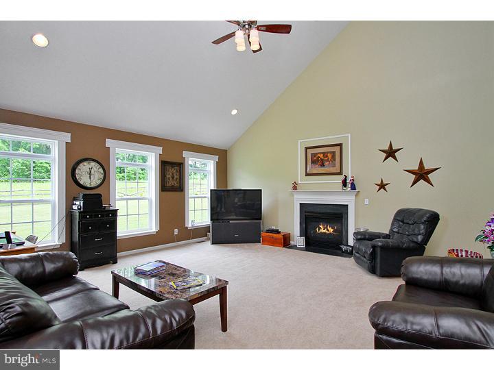 160 Prairie View Lane Mickleton, NJ 08056 - Photo 9 of 20 a living room with furniture flat screen tv and a fireplace