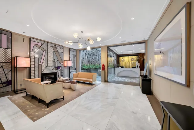 a front view of a building with a garden