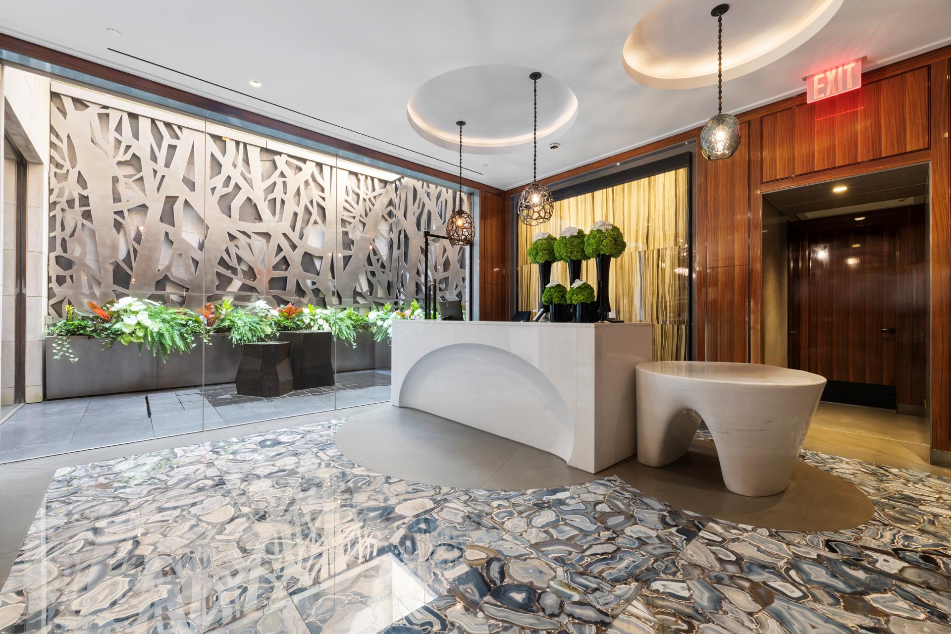 21 East 61st Street, Unit 9D Manhattan, NY 10065 - Photo 11 of 14 a view of a living room and a potted plant