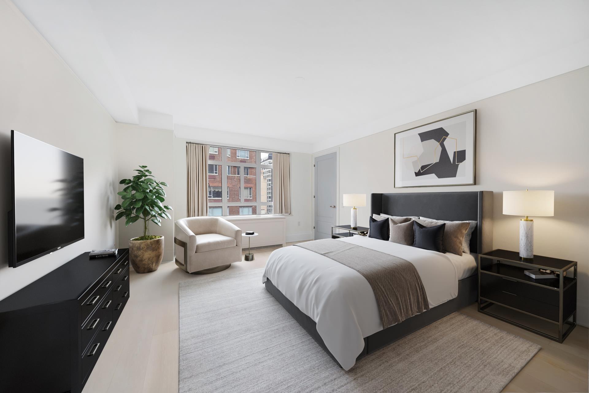 21 East 61st Street, Unit 9D Manhattan, NY 10065 - Photo 4 of 14 a bedroom with a bed and a flat screen tv