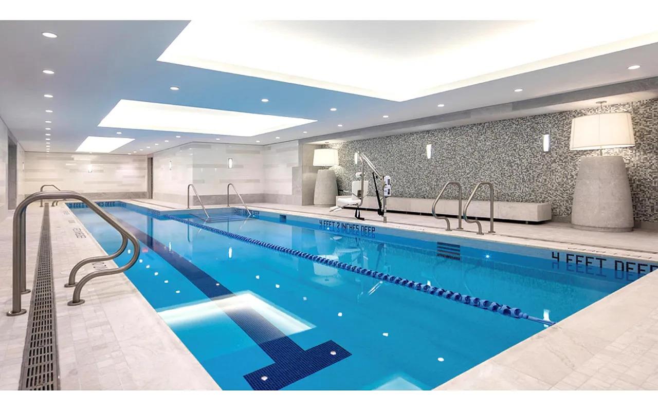 21 East 61st Street, Unit 9D Manhattan, NY 10065 - Photo 7 of 14 a bathroom with a large mirror