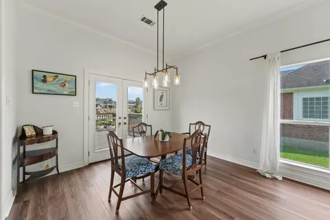a kitchen with stainless steel appliances kitchen island granite countertop a refrigerator and a stove top oven