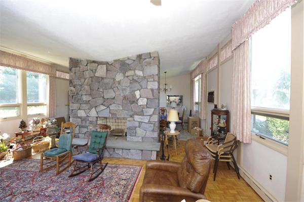 118 Forbes Road Milton, MA 02186 - Photo 8 of 10 a living room with furniture and a fireplace