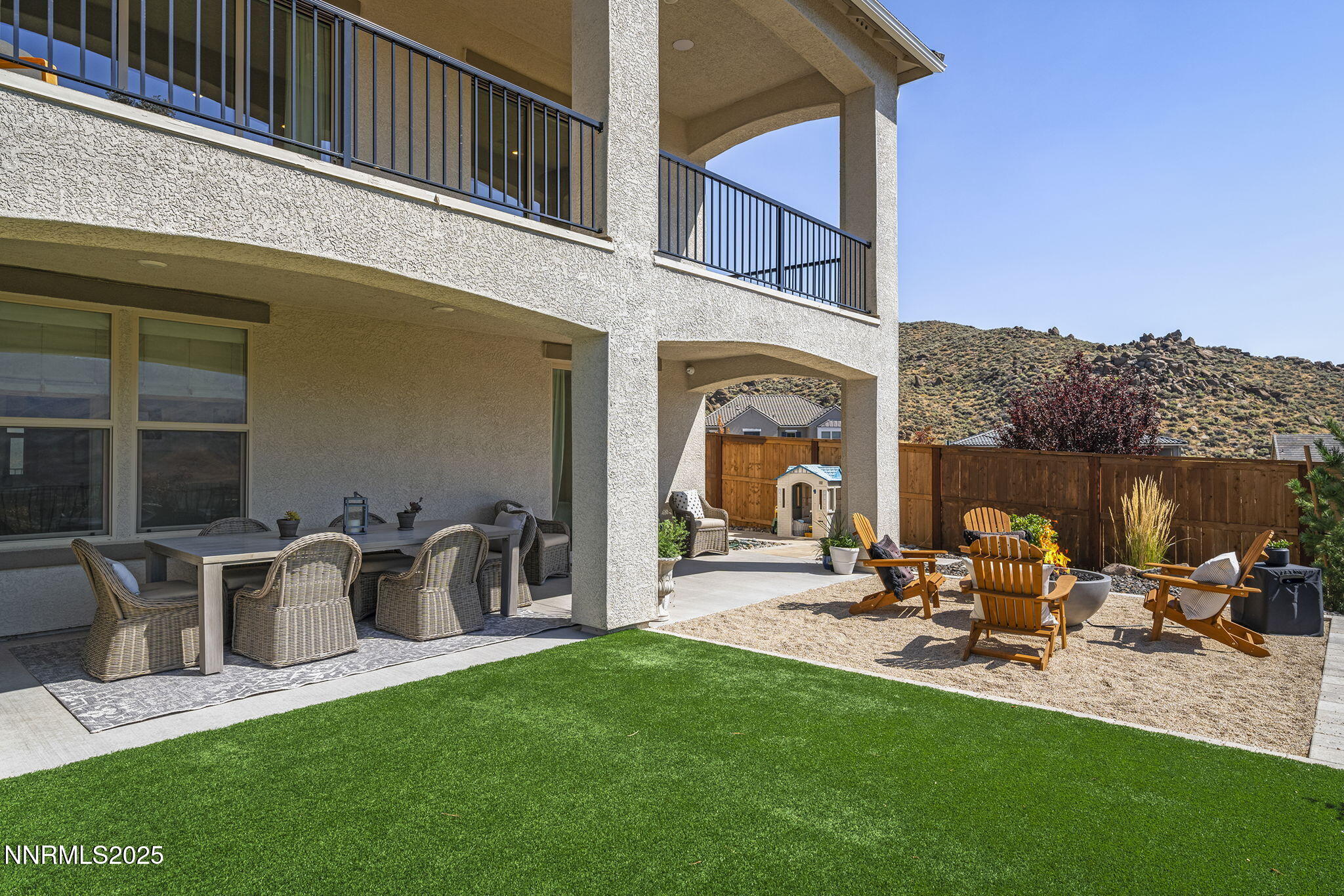 480 Gooseberry Drive Reno, NV 89523 - Photo 42 of 48 a view of a patio with table and chairs potted plants with floor to ceiling window