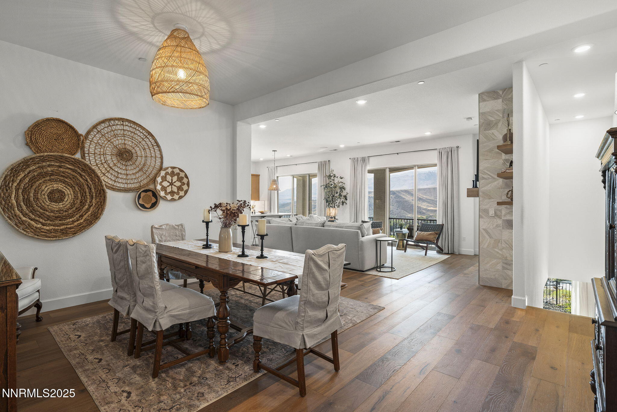 480 Gooseberry Drive Reno, NV 89523 - Photo 5 of 48 a dining room with wooden floor a chandelier a wooden table and chairs