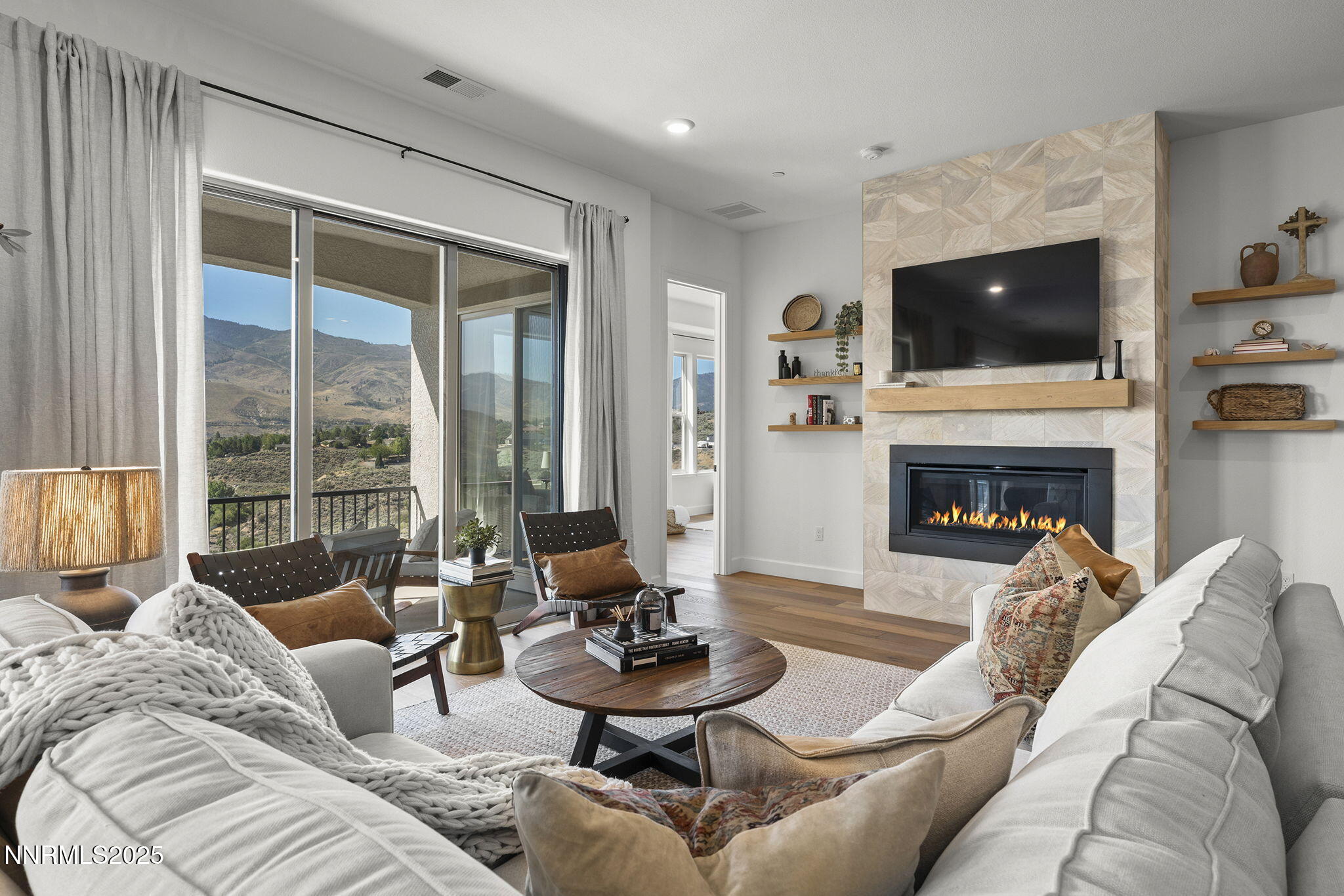 480 Gooseberry Drive Reno, NV 89523 - Photo 8 of 48 a living room with furniture a flat screen tv and a fireplace