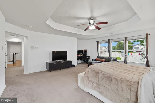 a bathroom with a bathtub shower and sink