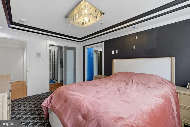 a bathroom with a sink a toilet a mirror and shower