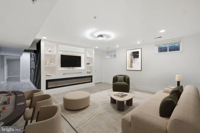 a living room with furniture and a table