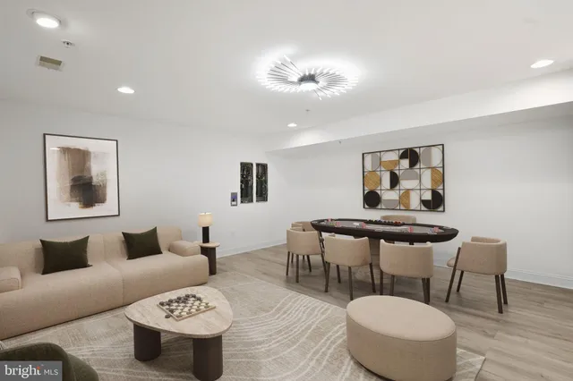 a kitchen with stainless steel appliances kitchen island granite countertop a sink and cabinets