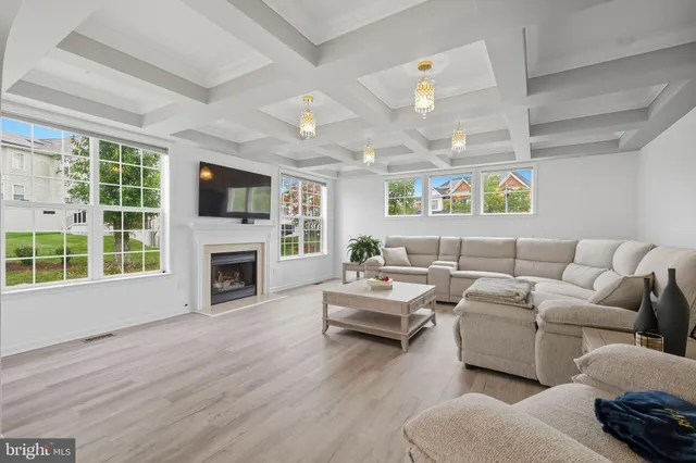 a living room with furniture fireplace and flat screen tv